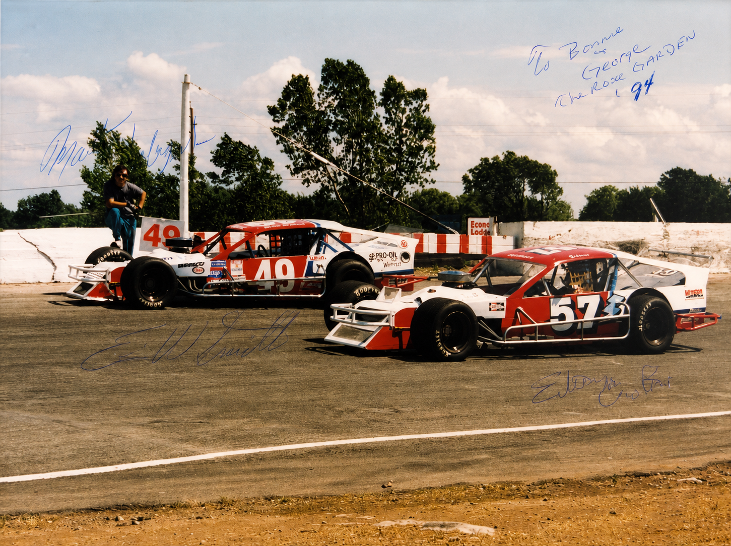 Signed historical photograph of the number 49 and number 57 modified race cars together at the track